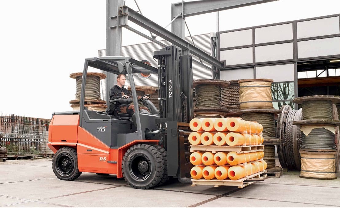 Forklifts For Hire In London unloading a stack of tubes